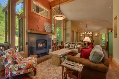 a living room with a couch and a fireplace at Fairway Favorite - Walk to Tahoe City Shops, Dining & Lake - Pet Friendly in Tahoe City