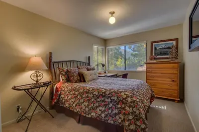 a bedroom with a bed and a dresser and a window at Rocky Point #93 3BR Townhome in Northstar - Shuttle to Slopes - HOA Amenities in Truckee