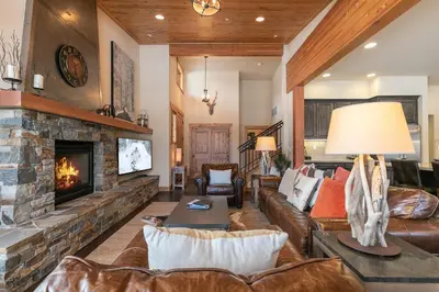 a living room with a couch and a fireplace at Trestlewood Lodge at Schaffers Mill - Gorgeous 3 BR w Golf Course Views - Extended Stays Welcome! in Truckee
