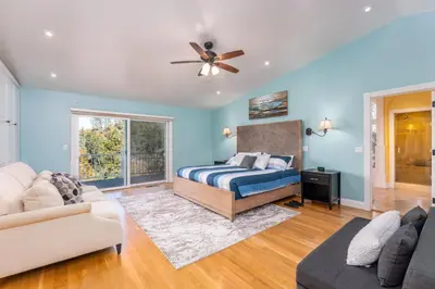 a bedroom with a bed and a couch at Yosemite Bass Lake VIEWS, 2 Homes, Games, Hot Tub in Coarsegold