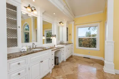 a bathroom with two sinks and two mirrors at Yosemite Bass Lake VIEWS, 2 Homes, Games, Hot Tub in Coarsegold