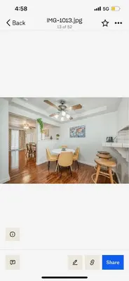 a room with a table and chairs and a dining room at Del Mar pool Home in Fresno