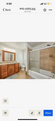 a bathroom with a sink and a mirror at Del Mar pool Home in Fresno