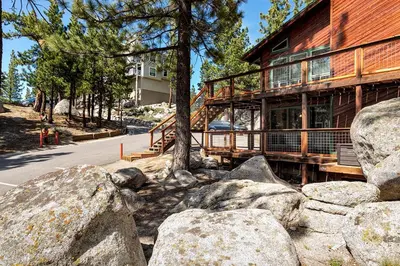 a house with rocks in front of a building at Snowflake Chalet in Stateline