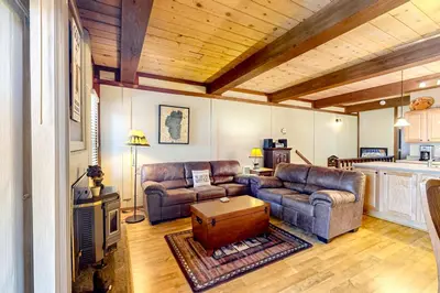 a living room with two couches and a table at Kelly's Kastle in Incline Village