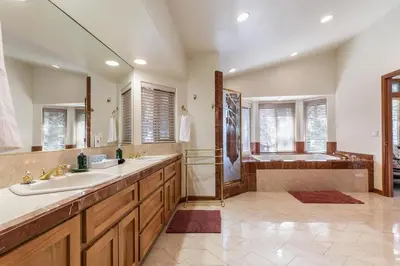 a large bathroom with two sinks and a shower at Silver Rock Lodge in Zephyr Cove