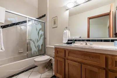 a bathroom with a shower and a toilet and a sink at Silver Rock Lodge in Zephyr Cove