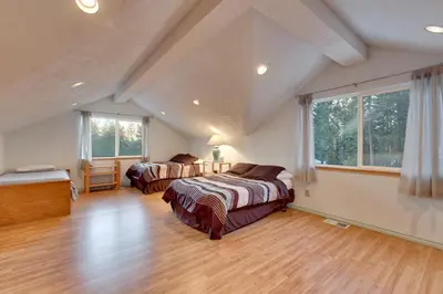 a bedroom with two beds in a attic at Sequoia Chalet in Stateline
