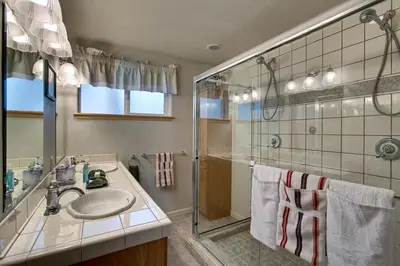 a bathroom with a sink and a shower at Sequoia Chalet in Stateline