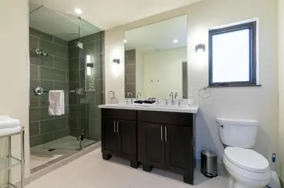 a bathroom with a toilet and a sink and a shower at Crystal Bay Penthouse 301 in Crystal Bay