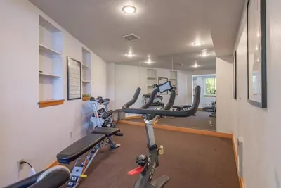 a gym with a row of exercise bikes in a room at VIP Lakefront Condo Amazing Views Pool Pickleball Excellent Location Balcony BBQ in Kings Beach