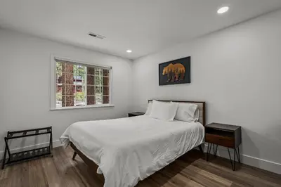 a white bedroom with a bed and a window at Tahoe Family Friendly Home in Incline Village