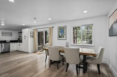 a kitchen and dining room with a table and chairs at Tahoe Family Friendly Home in Incline Village