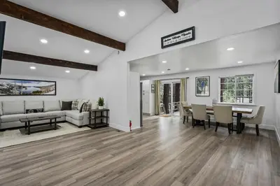 a living room with a table and a couch at Tahoe Family Friendly Home in Incline Village