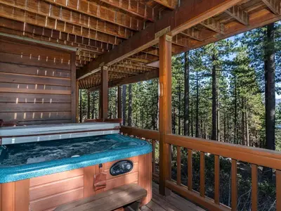 a hot tub on a deck in the woods at Tahoe Pines, enjoy the outdoors this home has to offers in Incline Village