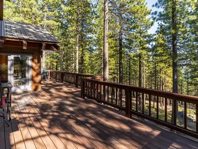 a wooden deck on a cabin in the woods at Tahoe Pines, enjoy the outdoors this home has to offers in Incline Village