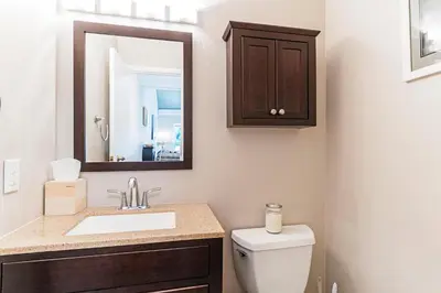 a bathroom with a toilet and a sink and a mirror at The perfect getaway for a small group or families in Incline Village