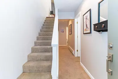 a staircase in a home with white walls and carpet at The perfect getaway for a small group or families in Incline Village