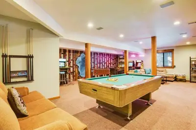 a living room with a pool table in it at Luna Cabin - 5BR Hot Tub A/C Game Room EV Charger in Tahoe Vista