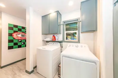 a small laundry room with a washer and dryer at Starry Night Cabin at Sky Ranch in Oakhurst