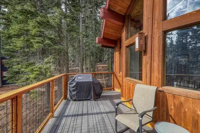 a deck with two chairs and a tent on it at Sherwood Chalet - Quiet 3 BR in Ward Canyon, Private Hot Tub, Near Sherwood Chairlift in Tahoe City