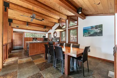 a kitchen and dining room with a wooden table and chairs at Sherwood Chalet - Quiet 3 BR in Ward Canyon, Private Hot Tub, Near Sherwood Chairlift in Tahoe City