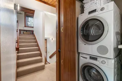 a laundry room with a washer and dryer at Sherwood Chalet - Quiet 3 BR in Ward Canyon, Private Hot Tub, Near Sherwood Chairlift in Tahoe City