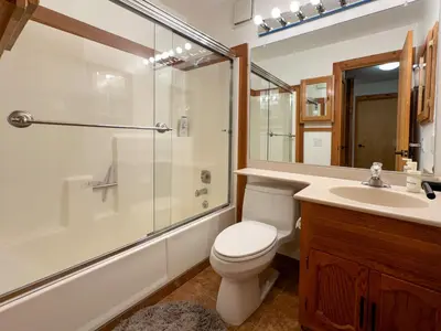 a bathroom with a toilet and a shower and a sink at Lofty Retreat, Condo in Northstar in Truckee