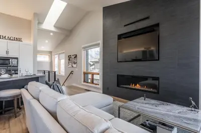 a living room with a couch and a fireplace at Snowcreek V 972 in Mammoth Lakes