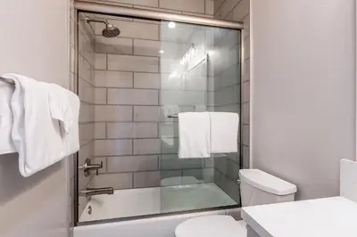a bathroom with a shower and a toilet and a sink at Snowcreek V 972 in Mammoth Lakes