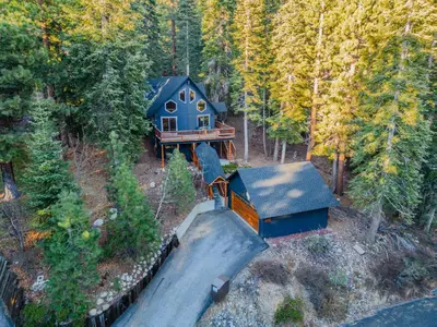 an aerial view of a house in the woods at North Shore - Pinetree Paradise in Tahoe Vista