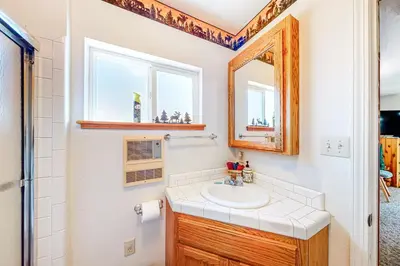a bathroom with a sink and a mirror at Pine Needle Nook in Kings Beach