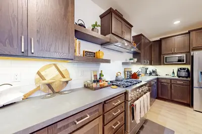 a kitchen with wooden cabinets and a stove top oven at Creekhouse 1362 in Mammoth Lakes