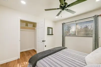 a bedroom with a bed and a ceiling fan at Visalia Vacation Rental with Yard 1 Mi to Downtown in Visalia