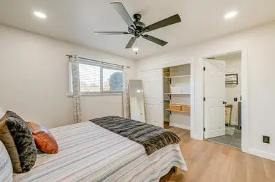 a bedroom with a bed and a ceiling fan at Visalia Vacation Rental with Yard 1 Mi to Downtown in Visalia