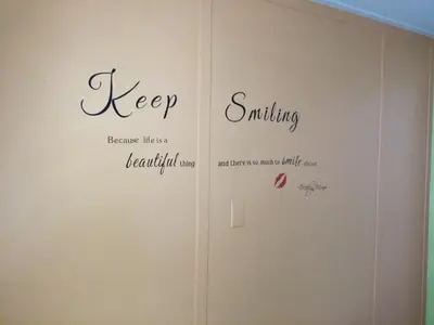 a room with three words on a wall at Yosemite International Hostel in Groveland