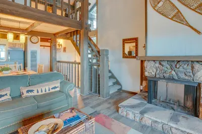 a living room with a couch and a fireplace at 1 Mi to Stagecoach Lift! Homey Tahoe Townhome in Stateline