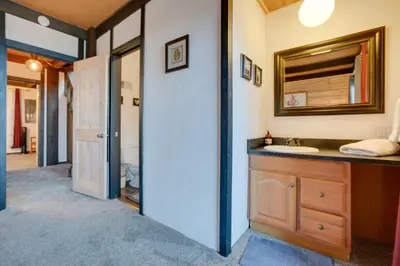 a bathroom with a sink and a mirror at 1 Mi to Stagecoach Lift! Homey Tahoe Townhome in Stateline
