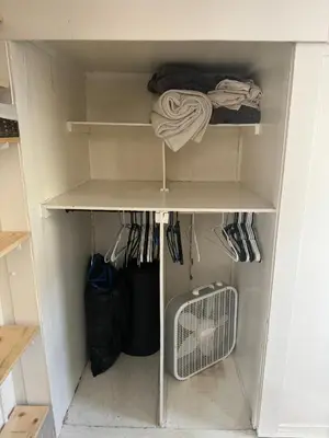 a walk in closet with at Midtown Charm: 1BR Urban Pad in Reno