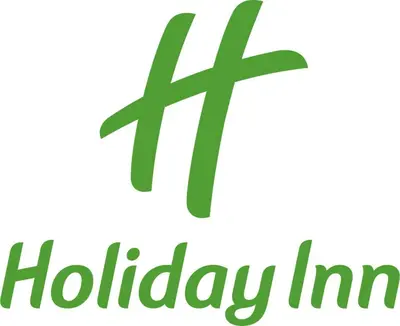 a green holiday inscription with a cross on a white background at Holiday Inn Express & Suites Fresno Airport by IHG in Fresno