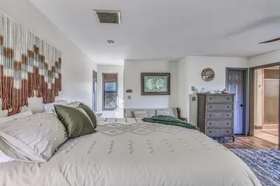 a bedroom with a large white bed and a dresser at Cozy Studio with Well-Being Retreat Near Yosemite! in Ahwahnee