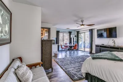 a bedroom with a bed and a living room at Cozy Studio with Well-Being Retreat Near Yosemite! in Ahwahnee