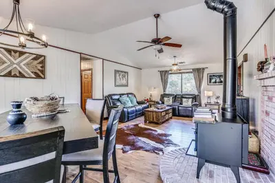 a living room with a wood burning stove in it at Mountain Home Near Yosemite with Well-Being Retreat! in Ahwahnee