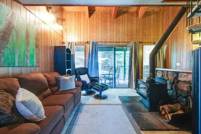 a living room with a couch and a fireplace at Strawberry Townhouse Walk to Leland Snowplay! in Strawberry