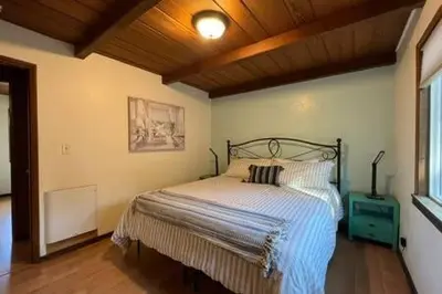 a bedroom with a bed in a room at Blue Door Cottage 12 miles to Yosemite Bbq in Oakhurst