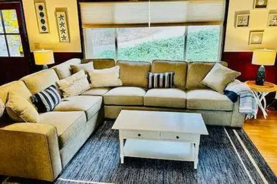 a living room with a couch and a coffee table at Blue Door Cottage 12 miles to Yosemite Bbq in Oakhurst