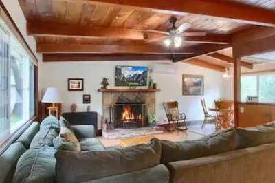 a living room with a couch and a fireplace at Red Door Cottage Fireplace bbq 12 mi to Yosemite in Oakhurst