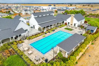 an aerial view of a home with a swimming pool at Newly Built Tracy Home with Backyard and Pool Access! in Tracy
