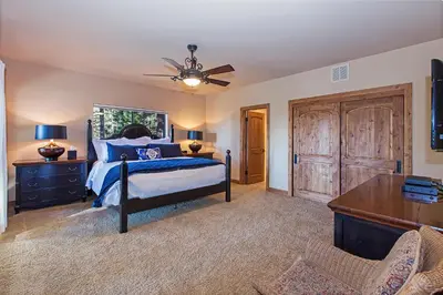 a bedroom with a bed and a ceiling fan at Luxury 4 bedroom 4 5 bath luxury home that sleeps 10 in Incline Village