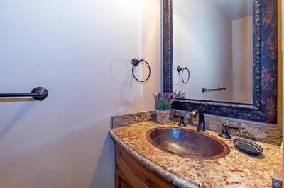 a bathroom with a sink and a mirror at Luxury 4 bedroom 4 5 bath luxury home that sleeps 10 in Incline Village